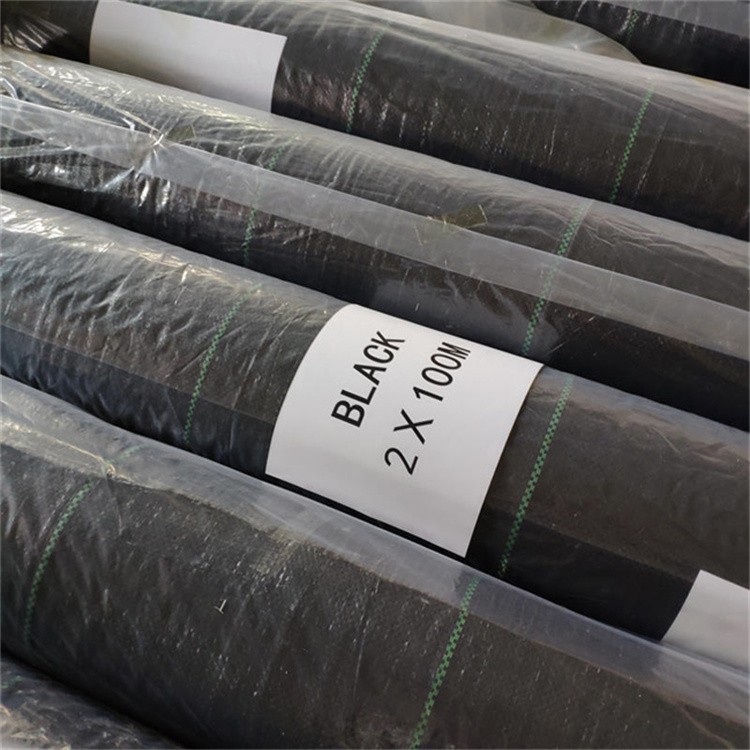 Woven weed barrier landscape fabric